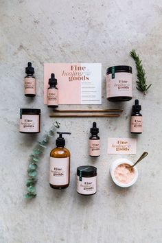 the contents of an organic skin care product displayed on a white surface with greenery