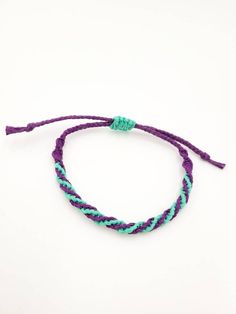 Hemp Bracelet Adjustable Purple and Teal Double Spiral Double spiral adjustable hemp bracelet in purple and teal. Sliding clasp for adjustability. I use Hemptique brand hemp which uses non-toxic and azo-free dyes. To extend the life of your hemp jewelry, please avoid exposure to water such as wearing while bathing or swimming. String Bracelet Patterns, Hemp Bracelet, Hemp Jewelry, Hemp Bracelets, Purple And Teal, Small Workshop, String Bracelet, Braided Bracelets, Bracelet Patterns