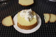 there is a piece of cake on the plate next to slices of bread and whipped cream