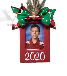 This red photo ornament is shown with a green Santa print bow and is made to hold a wallet size photo. The year 2020 is on the bottom but it can be personalized as well. Just leave your personalization request in the notes to seller area of your order. Thank you! Photo Christmas Gifts, Clip Picture Frame, School Pics, Hand Painted Frames, Green Santa, Christmas Frame, Christmas Frames, Photo Christmas, School Pictures