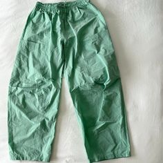 These Super Trendy Uo Pant Don't Have Tags But Have Never Been Used!!!!! - Wide Leg - Baggy - Green Color Has A Slight Shimmer In The Sunlight - Adjustable Drawstring Waistband - Nylon Fabric - 2 Pockets Green Parachute Pants With Elastic Waistband, Relaxed Fit, Green Relaxed Fit Parachute Pants With Elastic Waistband, Green Parachute Pants With Relaxed Fit And Elastic Waistband, Casual Green Cargo Pants For Loungewear, Green Cotton Cargo Pants For Loungewear, Green Parachute Pants For Spring Loungewear, Casual Pants With Elastic Waistband By Urban Outfitters, Casual Urban Outfitters Pants With Elastic Waistband, Green Relaxed Fit Bottoms From Urban Outfitters