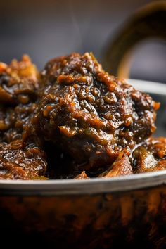 pork vindalloo in a bowl with the words pork vindallo on it