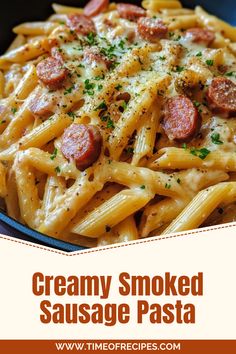 creamy smoked sausage pasta in a blue bowl with parsley on top and text overlay that reads, creamy smoked sausage pasta