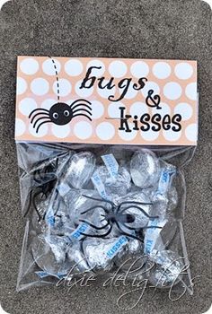 an image of some candy wrapped in cellophane with spider on the front and back