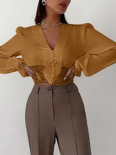 This elegant tops pairs perfectly with your favorite pants, skirt or dress up your favorite jeans with lovely top & heels. Featuring a v-neckline, button-up detail and lace lace cuffs with lace detail. Comes in three fabulous colors from which to choose and made with a polyester blend. Fall V-neck Blouse With Lace Patchwork, Chic V-neck Lace Top With Lace Trim, V-neck Blouse With Lace Patchwork For Fall, Spring V-neck Top With Lace Cuffs, V-neck Lace Patchwork Top For Fall, V-neck Lace Trim Blouse For Work, Chic V-neck Lace Top For Fall, V-neck Blouse With Lace Trim For Work, Elegant V-neck Lace Top For Fall