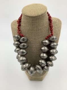 I made this lovely 2 strand neckpiece with handmade tuareg silver from Mali, West Africa and small red Turquoise Howlite beads. Authentic antique beads will commonly have small chips, corrosion and pitting due to their vintage. Each recycled / handmade bead is unique in shape, size and markings. Necklace Weight & Length: Weight 7 Ibs 2 oz Length 21 in Red Fair Trade Jewelry With Round Beads, Fair Trade Red Jewelry For Festivals, Red Fair Trade Jewelry For Festivals, Artisan Red Fair Trade Necklace, Silver Southwestern Beads For Gifts, Artisan Soldered Round Beads Jewelry, Artisan Silver Turquoise Necklace With Large Beads, Handmade Southwestern Silver Beaded Necklaces, Handmade Silver Beaded Southwestern Necklace