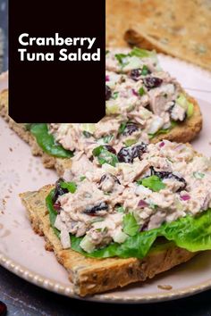 two pieces of bread with tuna salad on it and the words cranberry tuna salad