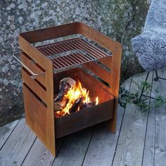 an outdoor fire pit on a wooden deck