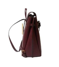 Michael Kors Emilia Medium Pebbled Leather Backpack in Merlot with gold-tone hardware. Flap top magnetic closure. 2 interior compartments. Approximately 10" (L) X 12"(H) X 6"(D). 2.5" top handle. Adjustable backpack straps. Classic Office Backpack With Removable Pouch, Elegant Office Backpack, Elegant Crossbody Backpack For Daily Use, Classic Formal Backpack With Removable Pouch, Formal Satchel Backpack With Adjustable Strap, Classic Michael Kors Bag For Daily Use, Everyday Textured Leather Satchel Backpack, Classic Textured Leather Backpack Bag, Luxury Backpack With Textured Leather For Daily Use