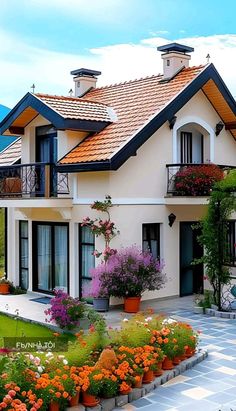 a house with flowers in the front yard