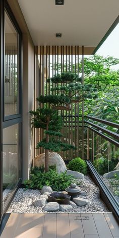 an indoor garden with rocks and trees