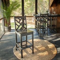 an outdoor dining area with chairs and table