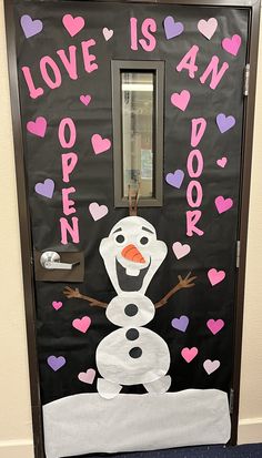 a door decorated to look like a snowman with hearts on it and the words love is an open door