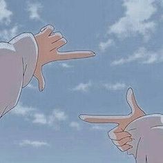 two hands pointing at each other in the sky