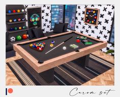 a pool table in the middle of a living room with balls and cues on it