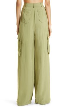 Cargo-style pockets lend practical appeal to high-waist pants kept free-flowing with a wide-leg silhouette. 34" inseam; 26" leg opening; 14 1/2" front rise; 18" back rise (size 8) 83% rayon, 17% nylon Dry clean Imported High Waist Wide Leg Pants, Ramy Brook, Cargo Style, Free Flowing, Waist Pants, High Waisted Pants, Leg Pants, Wide Leg Pants, Size 16