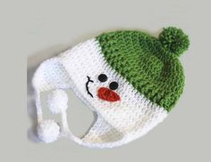 a crocheted hat with a snowman face on it