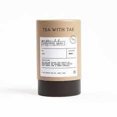 tea with tae candle in a tube on a white background, surrounded by black and brown labels