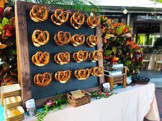 there are many pretzels hanging on the wall next to each other at this event