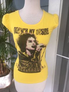 "A very cool Dolce & Gabbana bright yellow & black scoop neck 'Quench My Desire' Tee with princess puff sleeves. 70s cut. Size XS  (fits snugly on this size s mannequin)  bust measures 13 1/2\" straight across unstretched length measures 21\" from back collar to hem It's getting more and more difficult to find outstanding vintage pieces these days however Janet Planet has them in spades!" Vintage Stretch T-shirt For Spring, Fitted Yellow T-shirt With Graphic Print, Vintage Scoop Neck Top For Spring, Fitted Yellow Scoop Neck Top, Yellow Fitted Retro T-shirt, Fitted Yellow Retro T-shirt, Vintage Cotton Scoop Neck Top, Yellow Fitted Vintage Tops, Fitted Yellow Vintage Tops