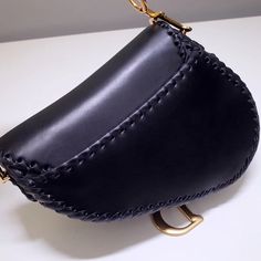 - 100% calfskin leather- Carried in the hand or on the shoulder- Short handle strap- Back pocket- Suede lining with 1 zip pocketSiz: 25.5 x 20 x 6.5 cm Dior Saddle, Saddle Bag, Dior Saddle Bag, Dior Bag, Saddle Bags, Saddle, Luxury Bags, Bags Women, Contact Us