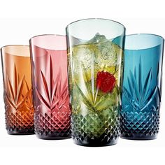 four different colored glass vases sitting next to each other