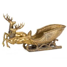 a brass statue of a reindeer sleigh with deer on it's back