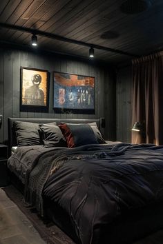 a large bed sitting in a bedroom next to two pictures on the wall above it