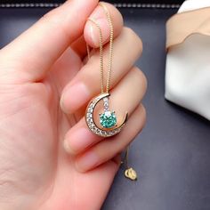 Gorgeous and delicate Green Moissanite necklace ， Nice gift for girlfriend/wife or Mother It will come with GRA Certificates， So please Don't worry about quality， Every stone is The Best！ Basic information Stone： Top grade Green Moissanite Color Grade：D color Clarity Grade ： VVS Stone Shape: Circle 6.5 mm Stone weight ： 1.0 ct Metal Materials: Sterling Silver Cut Grade ： Excellent Green Necklace With Moon Charm, Green Moon Charm Round Necklace, Green Moon Charm Necklace, Round Cubic Zirconia Emerald Necklace Gift, Gift Round Emerald Cubic Zirconia Necklace, Promise Jewelry, Green Moissanite, Shape Circle, Platinum Wedding Rings