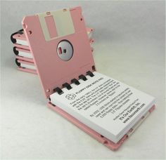 a pink floppy disk shaped like an old school computer with a keyboard attached to it