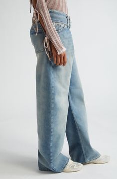 A belted low rise and extralong length amp up the modern insouciance of these wide-leg jeans that are crafted in Italy from faded, nonstretch-cotton denim. 32" inseam; 21" leg opening; 11" front rise; 14" back rise (size 36 EU) Zip fly with button closure; attached belt Five-pocket style 100% cotton Dry clean Made in Italy Designer Clothing Low Waist Wide Leg Jeans, Low Waist, Wide Leg Jeans, Leg Jeans, Low Rise, The Modern, Designer Clothing, Acne Studios, Wide Leg