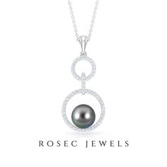 Product Details Elevate your style with the refined elegance of this exquisite Tahitian Pearl Pendant. The focal point of this pendant is a Brilliant Round Black Tahitian Pearl, delicately set in a secure Bead Setting, enhanced by a sparkling Diamond Halo and an intricate Eternity design. This dangle pendant is a remarkable addition to your jewelry collection, radiating timeless beauty and sophistication. Whether as a thoughtful gift for a loved one or a well-deserved treat for yourself, this pe Tahitian Pearl Necklace For Wedding, Tahitian Pearl Pendant, Stackable Jewelry, Tahitian Black Pearls, Circle Pendant Necklace, Sparkling Diamond, Signature Jewelry, Tahitian Pearls, Timeless Jewelry