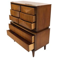 a wooden dresser with five drawers on it's sides and one drawer open to the side