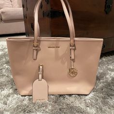 This Is A Brand New Bag That Has Never Been Used. Also Included Is A Matching Luggage Tag. Bag Retails For $298. 16 In Wide 10.5 In Deep 9 In Top Of Strap To Top Of Bag Color Is Nude/Beige Questions? Leave A Comment Below! Michael Kors Travel Bags With Large Capacity, Michael Kors Large Capacity Travel Bag, Bags Michael Kors, Luggage Tag, Luggage Tags, New Bag, Jet Set, Womens Tote Bags, Michael Kors