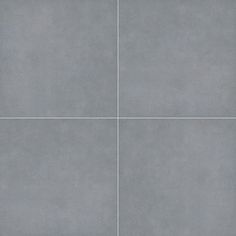 a gray tile floor with four squares in the middle