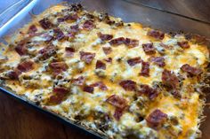 a casserole dish with bacon and cheese on it