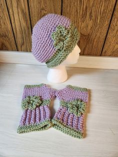 This beautiful set includes a hand-crocheted slouch hat and fingerless gloves featuring a boho style with a flower design. The color combination of purple and sage green is perfect for a casual occasion during fall and winter seasons. Made of high-quality acrylic material, these accessories are breathable and comfortable to wear. The accents include crochet and button, adding a unique touch to the design. This set is perfect for women who love handmade accessories and appreciate the art of crochet. I do not ship internationally. I do not refund for buyers remorse. Crochet Slouch Hat, Crochet Pot, Purple Sage, Crochet Gloves Pattern, Gloves Pattern, Crochet Inspo, Crochet Gloves, Slouch Hat, Pretty Purple