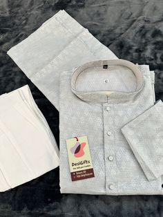 **Visit our store for full collection: https://www.etsy.com/shop/DesiGiftsUSA ** *Indulge in luxurious elegance for any occasion with this Kurta Pajama Set crafted from exquisite Jacquard silk fabric. Stay comfortably stylish with the intricate design and quality fabric. *Ready to wear *Kurta    : Silver Design in gray background *Pajama : White Bottom pant style (Trousers) *Pocket : Yes *Fabric : Blended Silk *Design KPS- 1409 Actual color of the dress may slightly vary due to the screen resolu Mens Indian Wear, Silk Design, Trouser Pocket, Style Trousers, Silk Kurta, Kurta Pajama, Silver Design, Pant Style, Intricate Design