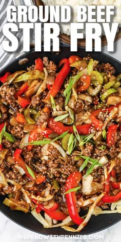 ground beef stir fry with peppers and onions in a skillet