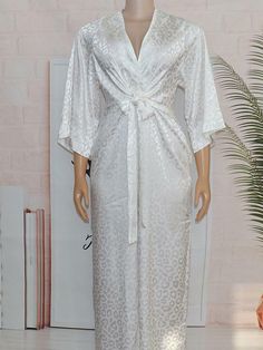 Product DetailsMaterial: 70%-80%DacronPattern Type:PrintNeckline: V-neckSleeves Type: Long SleeveDetails: PrintedStyle: CasualSlim Type: Regular FitBelt: NoWaist Line: High WaistSheer: NoBottom Type: Wide Leg White Stretch V-neck Jumpsuits And Rompers, White V-neck Jumpsuit With Tie Waist, White V-neck Jumpsuits And Rompers For Brunch, White V-neck Jumpsuits And Rompers For Daywear, White V-neck Jumpsuits For Daywear, Elegant V-neck Jumpsuits And Rompers For Daywear, African Jumpsuit, Jumpsuit V Neck, White Wide Leg Pants