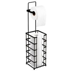 a roll of toilet paper sitting on top of a metal rack next to a roll of tissue