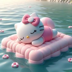 an inflatable hello kitty floating on the water