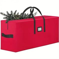 a red bag with a christmas tree in the bottom and black trimmings on top