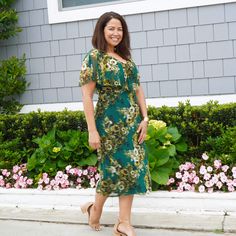 Sunny's allure lies in her adorable flirtatiousness. This floral v-neck midi dress features a chiffon flounce that harmonizes with its print, adding depth and a touch of femininity. Sunny’s side ruching beautifully complements your natural figure, while her floral-printed stretch knit fabric makes it an excellent choice for your upcoming daytime event. Details: Holly is 5’8” and wearing a size 8 Slip-on Sleeves with flounce Fitted top, A-line skirt Machine wash Body: Polyester, Spandex Style: TP Elegant Green V-neck Floral Dress, Green V-neck Midi Dress With Ruffle Hem, Chic Green V-neck Floral Dress, Green Knee-length Chiffon Dress For Spring, Green Chiffon Dress For Garden Party, Green Floral Print Midi V-neck Dress, Green Chiffon Midi Dress With Floral Print, Green Chiffon Dress With Ruffles For Garden Party, Flowy Green Chiffon Dress With Floral Print