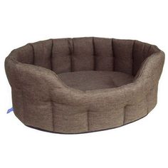 a dog bed that is made out of fabric and has a large round cushion on the bottom