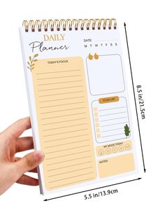 a hand holding a daily planner with notes on the front and back pages, next to a white background