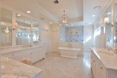 a large bathroom with two sinks and a bathtub