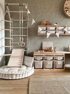 a living room filled with lots of furniture and storage containers on the wall next to a rug