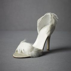 Step into elegance with our Ivory Satin Wedding Shoes. These stunning stiletto heel sandals feature delicate feather embellishments, adding a touch of glamour to your special day. Crafted from luxurious satin, these sandals offer both style and sophistication for your wedding ensemble. Color: Ivory Material: Satin Heel Type: Stiletto heel Heel Height: 4.72" / 120 mm approx Product measurements were taken using size 8. Please note that measurements may vary by size. Toe: Open toe Faux feather emb Stiletto Heels Sandals, Feather Shoes, Satin Wedding Shoes, Pencil Heels, Ballerina Heels, Heels Outfits, Sandals Outfit, Heels Classy, Satin Heels