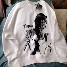 Womans Tupac Sweatshirt Trendy White Crew Neck Sweater, Tupac Shirt Outfit Women, White Hip Hop Sweater For Winter, White Long Sleeve Hip Hop Sweatshirt, White Graphic Print Sweater For Winter, Oversized White Hip Hop Top, Oversized White Hip Hop Sweatshirt, White Oversized Hip Hop Tops, White Sweater For Streetwear In Fall